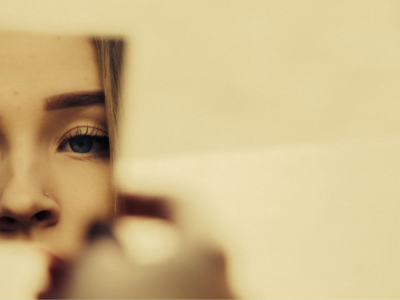 woman looking in a mirror
