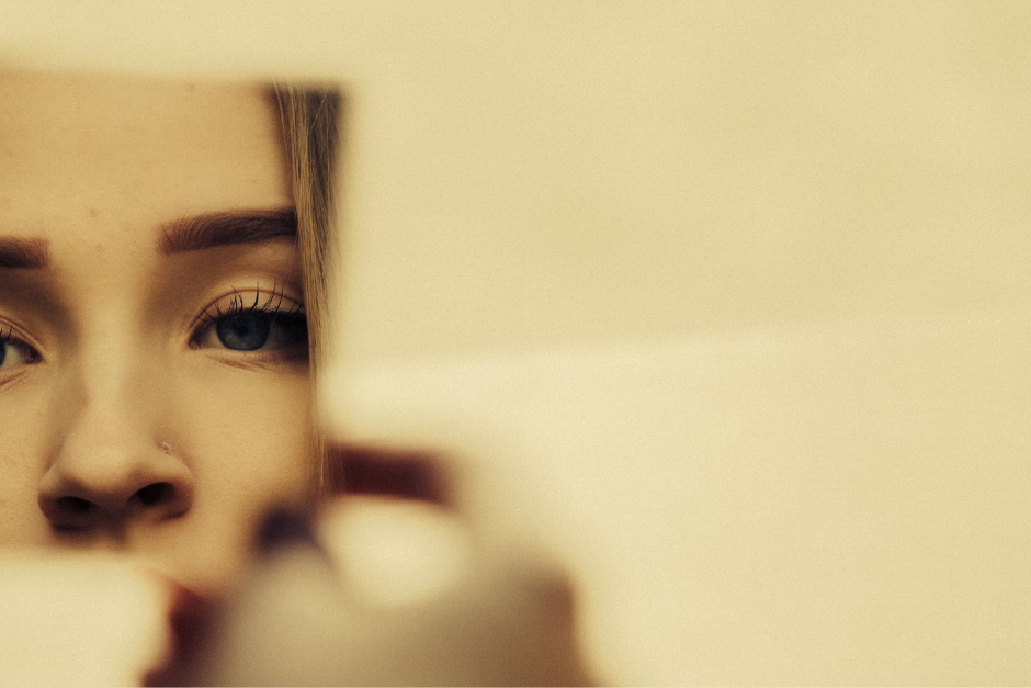 woman looking in a mirror