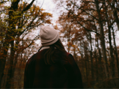 Woman walking in the woods