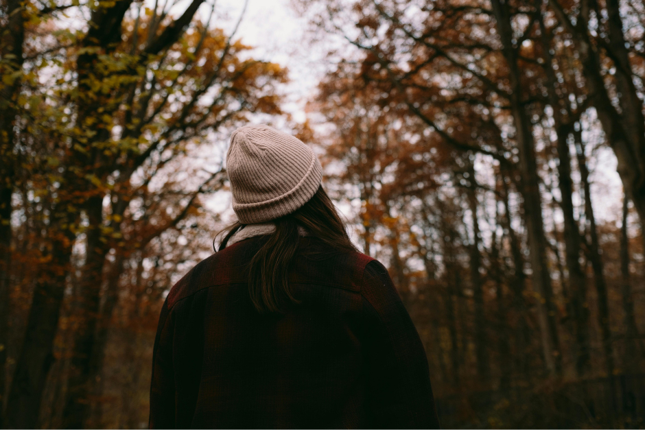 Woman walking in the woods