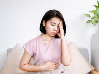 Woman with anxiety and a stomach ache
