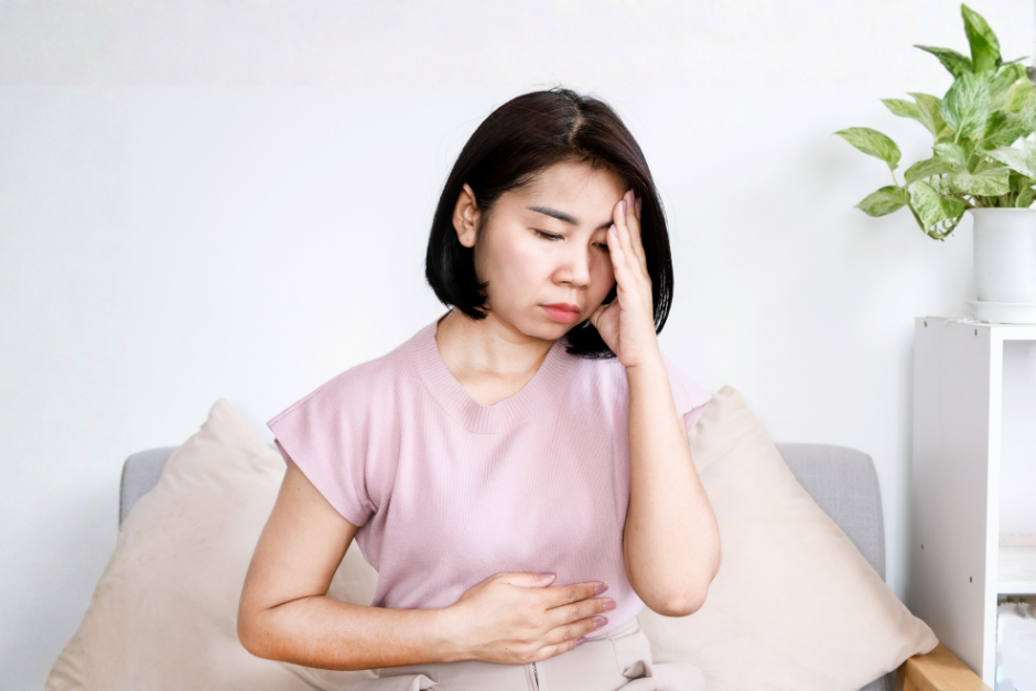 Woman with anxiety and a stomach ache