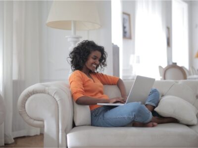 Woman on couch with her computer