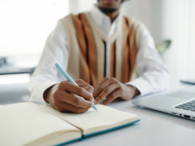 Man writing in journal