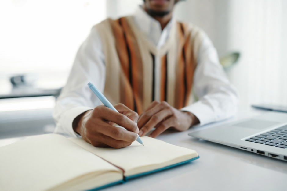 Man writing in journal