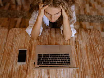 Woman stressed at her computer