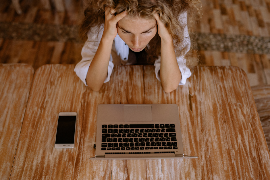 Woman stressed at her computer