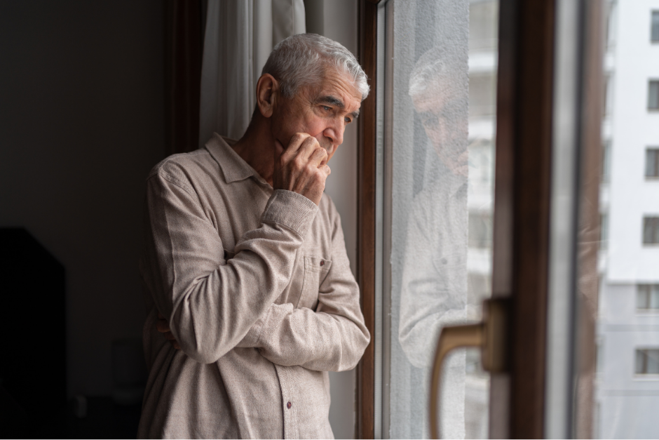 Man looking out of a window