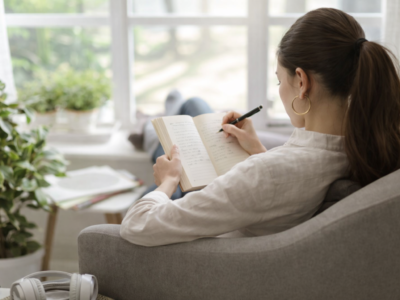 Woman writing in a journal