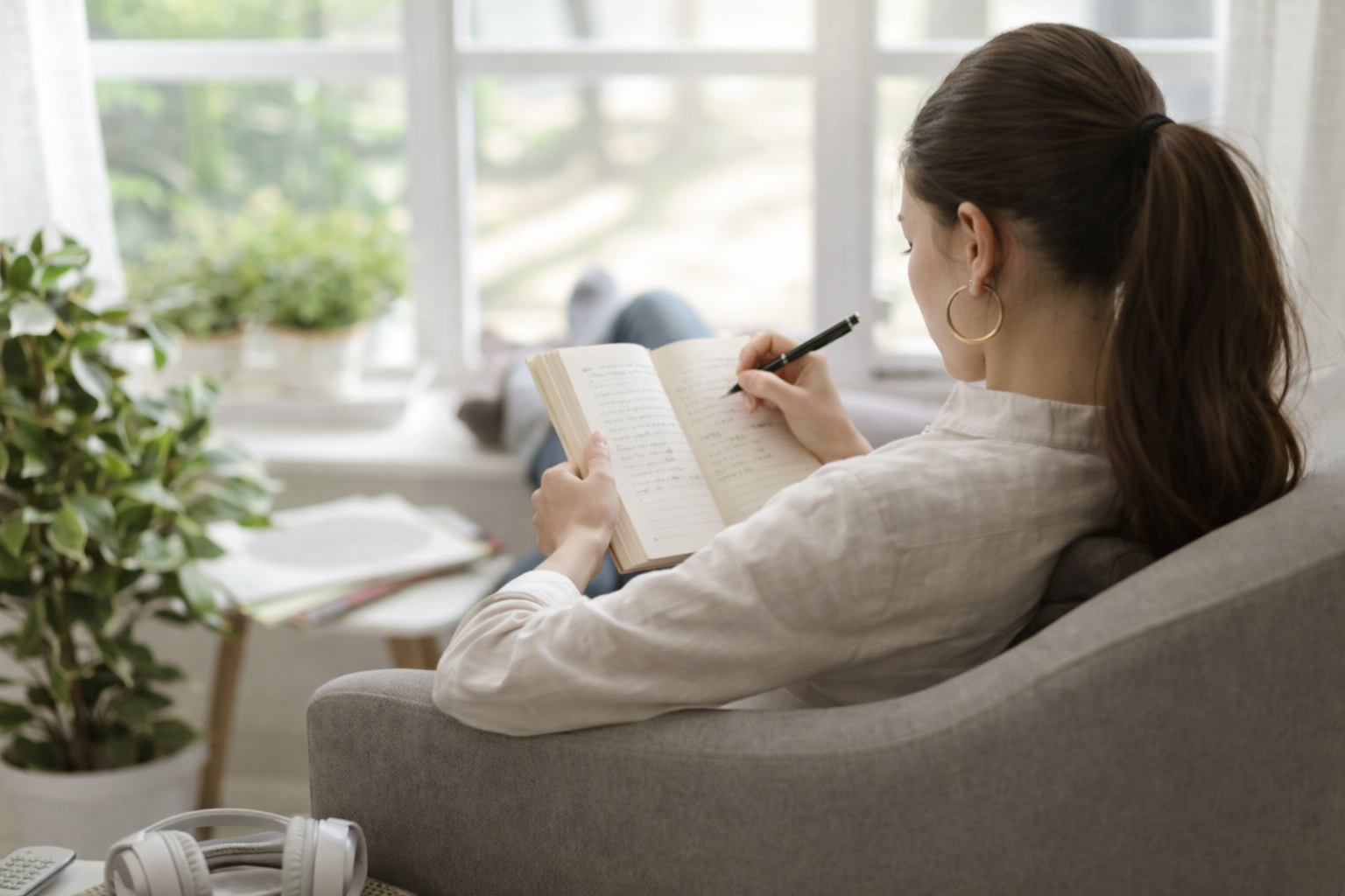 Woman writing in a journal