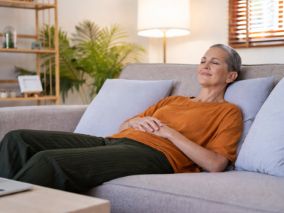 Woman reclining on her couch with closed eyes