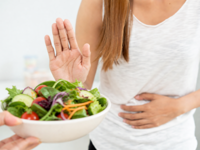 Woman avoiding eating a salad