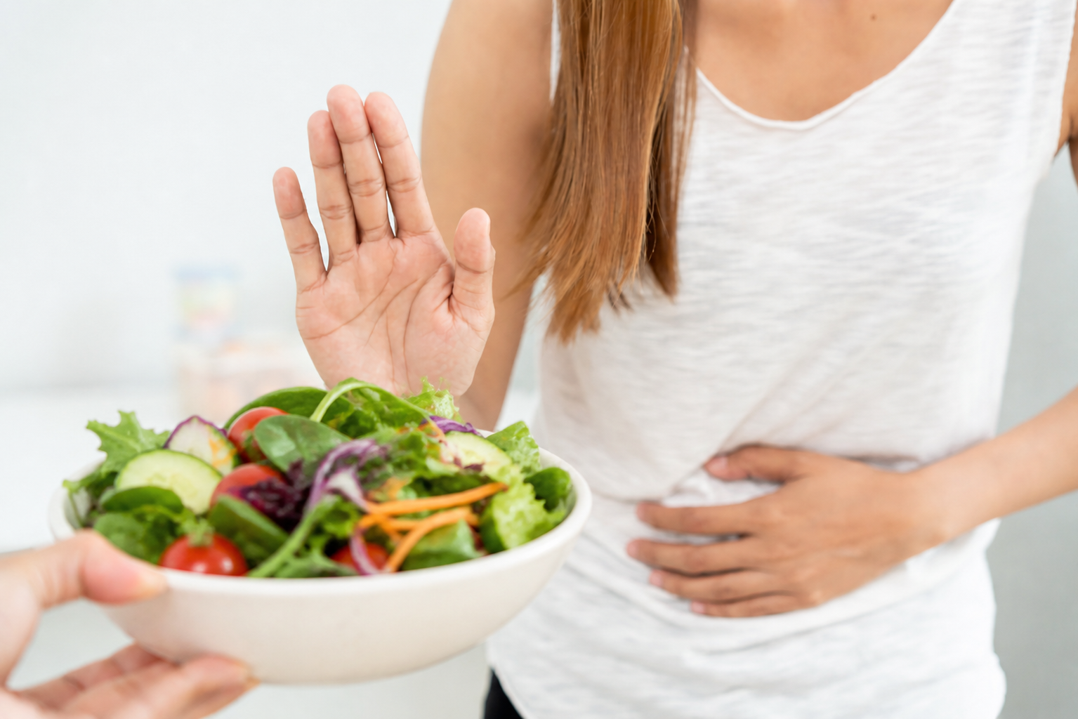 Woman avoiding eating a salad