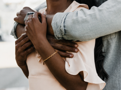 Two adults hugging