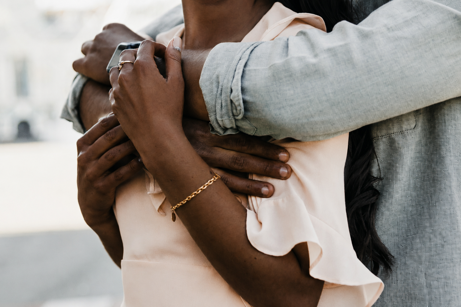 Two adults hugging